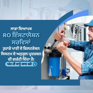 A plumber installing a RO water purifier