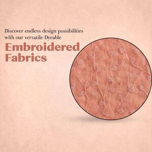 Close-up of embroidered fabric with the text 'Embroidered Fabrics'