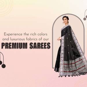 Woman wearing a black saree with silver embroidery