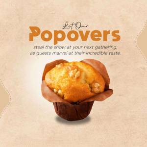 Close-up of a golden brown popover in a paper wrapper.