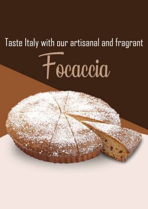 Close-up of a round focaccia bread sprinkled with powdered sugar