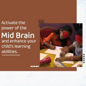 Children participating in a mid-brain activation workshop, wearing blindfolds and writing.