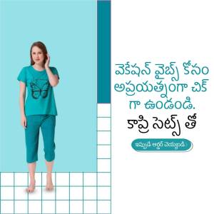 Woman wearing a teal butterfly print pajama set