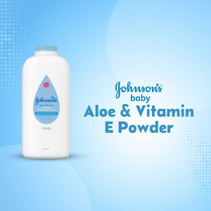 Close-up of Johnson's Baby Aloe & Vitamin E Powder bottle on a blue background