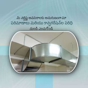 Close-up of a stainless steel kitchen exhaust hood being installed in a home.