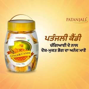 A jar of Patanjali Ginger Candy with product details in Punjabi.