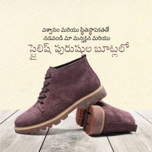 Pair of maroon suede boots on a wooden surface