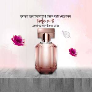 Elegant perfume bottle with floral accents on a light pink background.