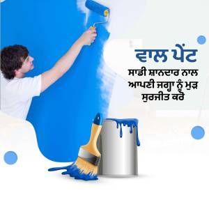 A man painting a blue wall with a roller and paint can.