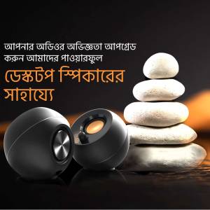 Black desktop speakers with stacked stones, promoting relaxation and sound quality.