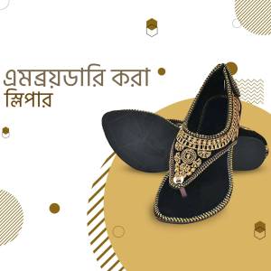 Black embroidered sandals on a golden background