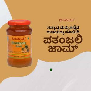 A jar of Patanjali Pineapple Jam against a beige and white background.
