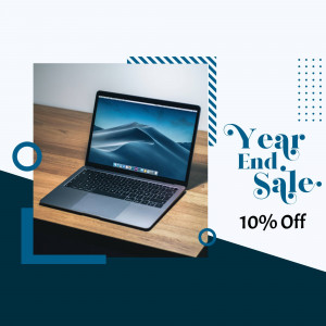 Laptop on a wooden desk with a Year End Sale promotion