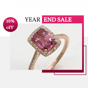 Close-up of a rose gold ring with a pink gemstone and diamond halo, advertising a year-end sale.