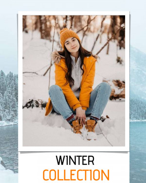 Woman wearing winter clothes sitting in the snow