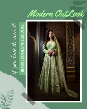 A woman wearing a beautiful green lehenga with intricate embroidery.