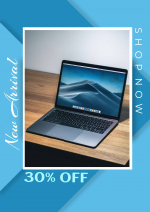 Silver laptop on a wooden table with a promotional offer.