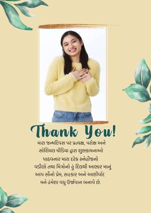 A thank you card featuring a smiling woman in a yellow sweater and green foliage.