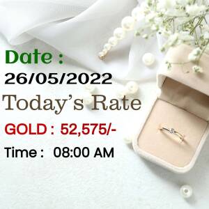 Close-up of a gold ring in a velvet box with price details
