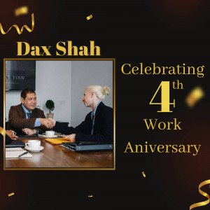 Image celebrating Dax Shah's 4th work anniversary with a handshake between two professionals.