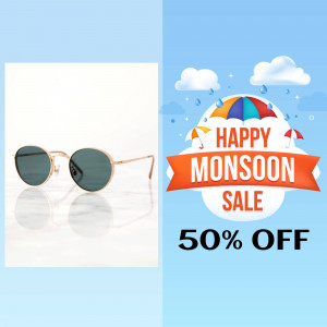 Sunglasses on marble surface with a Happy Monsoon Sale banner