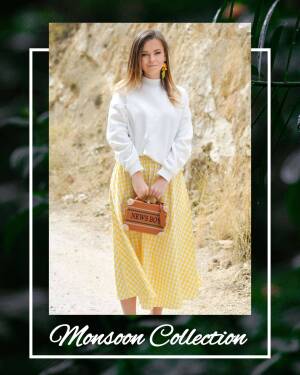 Woman in a white sweater and yellow checkered skirt holding a brown handbag