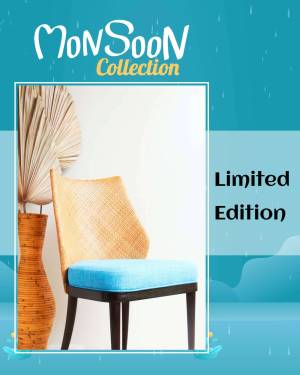 Rattan chair with blue cushion against a monsoon-themed background