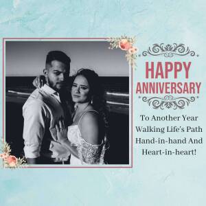 A couple celebrating their anniversary with a beachside photo and floral decorations.