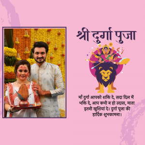 Image of a couple celebrating Durga Puja with a devotional backdrop.