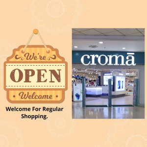 Croma store front with an 'Open' sign.
