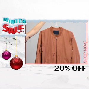 Brown bomber jacket on a hanger with winter sale promotion