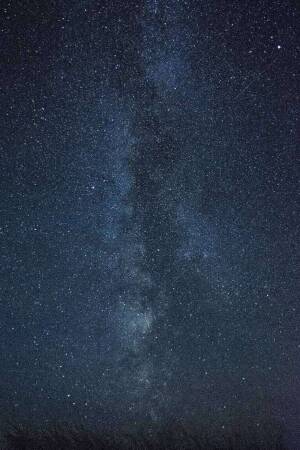 A stunning view of the Milky Way galaxy stretching across a dark night sky.