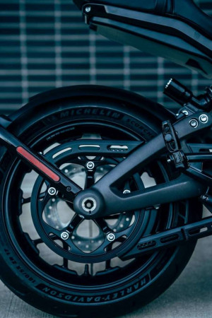 Close-up of a black Harley Davidson motorcycle wheel and brake system