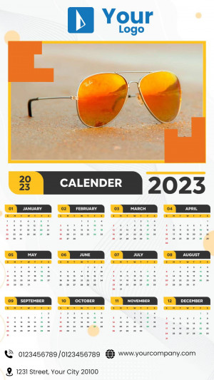 Calendar 2023 with sunglasses on a beach