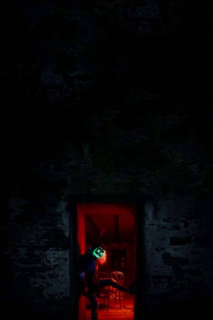 Mysterious Figure In Red Light Promotional Banner For WhatsApp