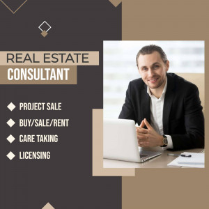 A professional real estate consultant working on a laptop.