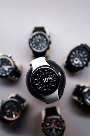 Overhead view of a collection of luxury watches, including smartwatches and traditional timepieces.