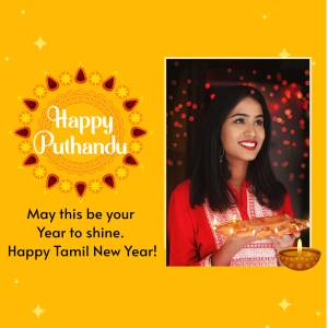A woman holding a traditional plate with lit lamps, celebrating Puthandu.