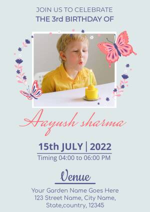 Birthday invitation featuring a boy blowing a candle with butterflies and floral decorations.