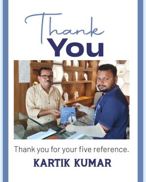 Two men exchanging a reference card in a jewelry store.