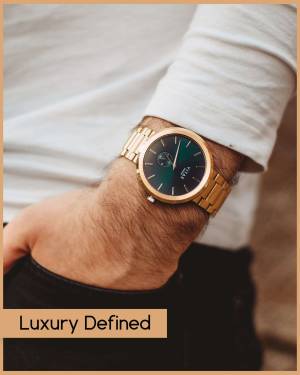 Close-up of a man wearing a gold and wood watch
