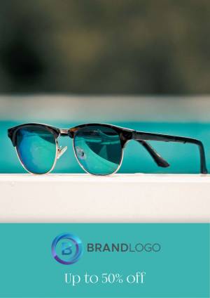 Close-up of black sunglasses with reflective lenses resting on a white surface with a turquoise pool in the background.