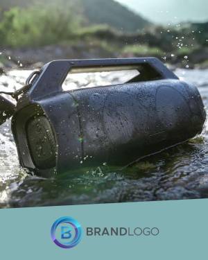 Black waterproof Bluetooth speaker submerged in water with splashes