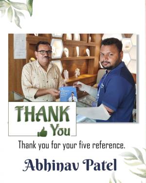 Two men in a jewelry store exchanging a card with a thank you message.