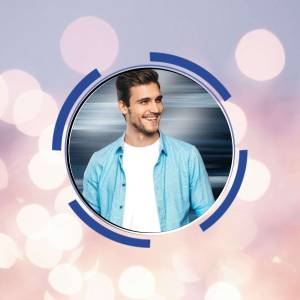 Portrait of a smiling young man in a blue shirt within a circular blue frame against a blurred bokeh background.