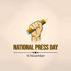 Illustration of a hand holding a pencil with rays of light, celebrating National Press Day.
