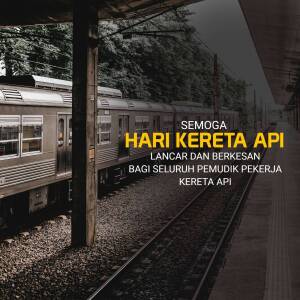 A train parked at a station platform with a sign in Indonesian.
