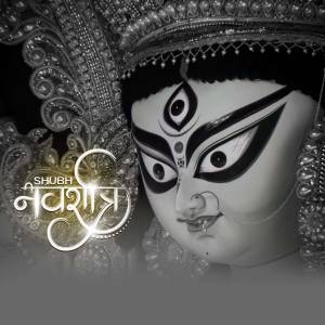 Close-up of Goddess Durga's face with intricate details and traditional makeup.