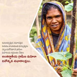 Portrait of an Indian woman farmer smiling in a field.
