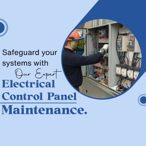 Electrician working on a control panel with safety gear